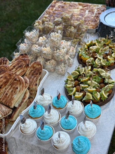Outdoor Catering Table with Desserts and Snacks