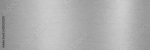 Brushed aluminum metal texture with horizontal grain, silver metallic background with soft light reflections, industrial steel surface for modern technology and hardware design projects