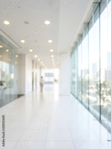 Blurred Modern Office Hallway With Bright Natural Light Background