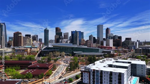 Aerial view of downtown Denver city skyline with blue sky during daytime.
