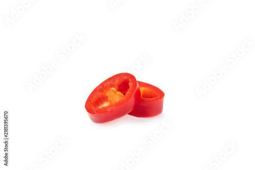 Red chili pepper isolated on white background. Fresh slice of hot pepper. Vegan, vegetable. Pepper cut into slices on a white background close-up.