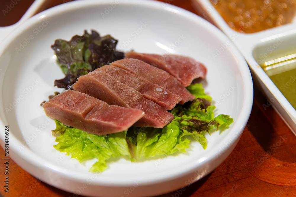 Fototapeta premium Fresh Korean Fermented Skate Liver Hongeo Ae Delicacy on Lettuce