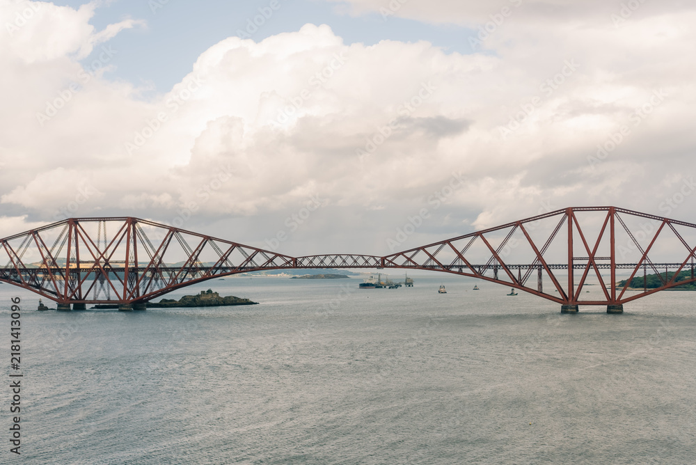 Fototapeta premium Iconic red Forth Bridge railway viaduct spanning the Firth of Forth in Scotland, UK - 4 September 2026.