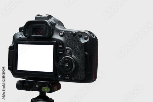 Obraz na plátně Digital Single Lens Reflex Camera On Tripod Against Neutral Background