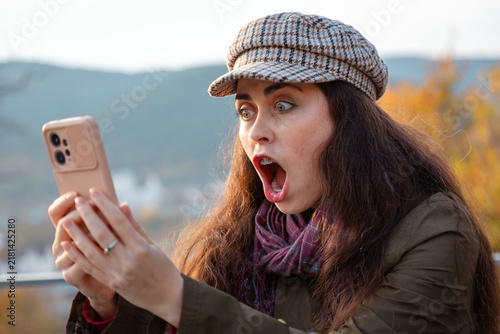 Obraz na płótnie Portrait of young woman reacting emotionally during an unpleasant video conversation