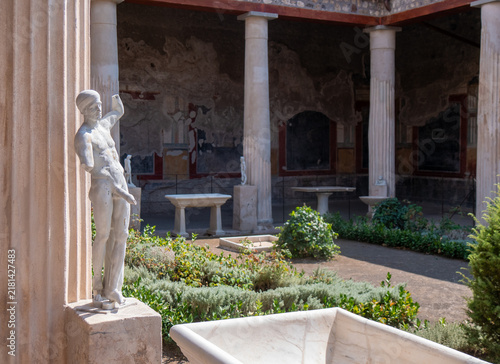 Priapus, Ancient statue of symbol of the fertility of ancient Rome, in the garden of the House of the Vettii in Pompeii destroyed by the eruption of Mount Vesuvius in 79 BC.