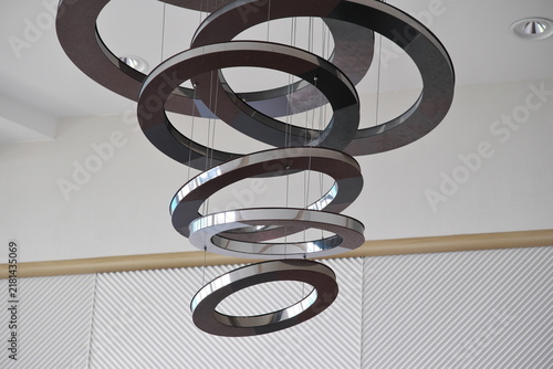 Fotografie Modern chandelier with geometric rings in contemporary interior