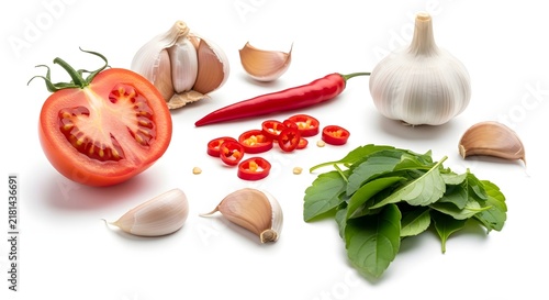 Fresh Natural Cooking Ingredients Including Tomatoes Garlic Chili and Green Herbs Prepared Together for a Homemade Kitchen Recipe