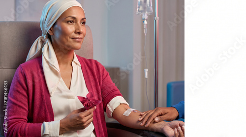 Woman receiving chemotherapy treatment in a medical setting  