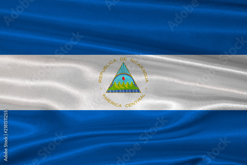 Nicaragua flag textured with fabric background. Flag of Nicaragua with a soft fabric texture