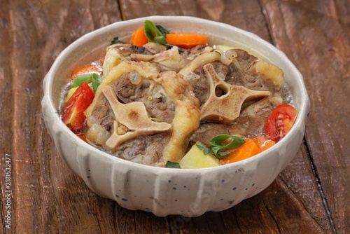 Canvas Print Sop buntut or oxtail soup, a traditional Indonesian oxtail soup made with tender beef oxtail simmered in a rich and flavorful broth with vegetables and aromatic spices