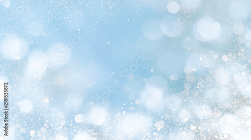 Obraz w ramie 雪のような光の粒が舞う水色と白の幻想的な冬のボケ背景