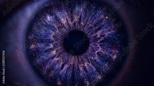 Close-up of a human blue eye iris with a galaxy universe cosmos and stars inside