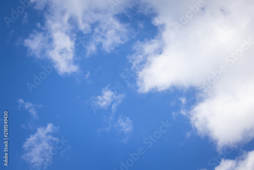 Wall Mural Clear blue sky with scattered white clouds