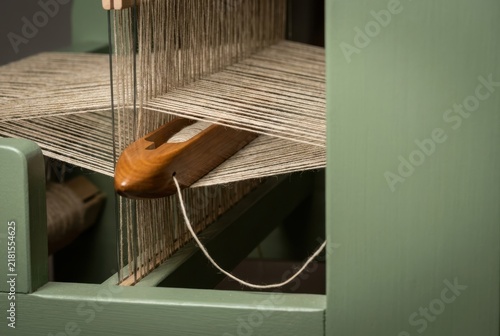 Obraz na płótnie Weaving loom with warp threads in textile workshop