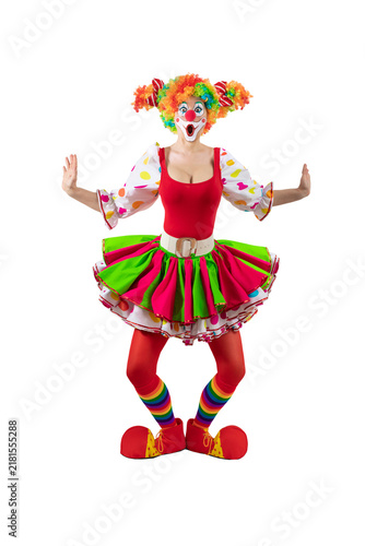 Fotografía Surprised female clown, woman entertainer dressed as a colorful Joker in a suit and wig, with clown whiteface makeup