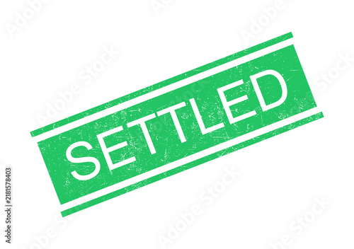 Green settled stamp with bold white text on transparent background