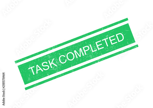Green task completed stamp with white text