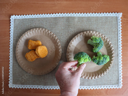 the choice between healthy broccoli and unhealthy chicken nuggets