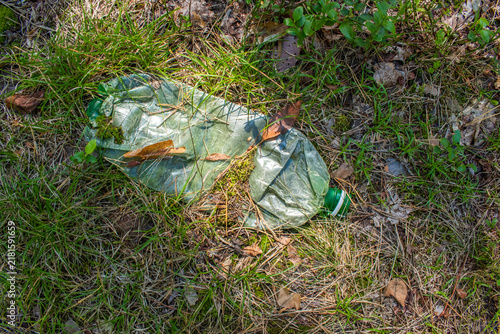 A plastic bottle crushed in the forest