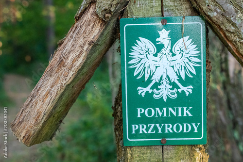 Natural monument sign with the Polish coat of arms