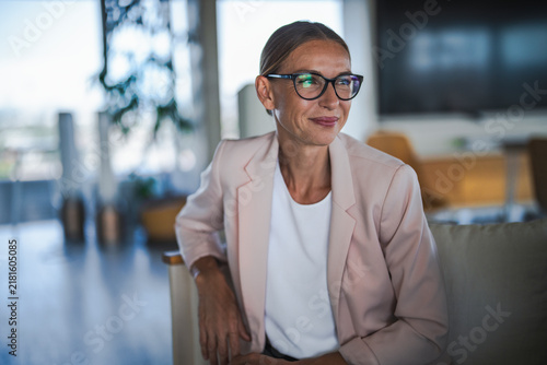 Mature businesswoman smiling during a consultation in the office