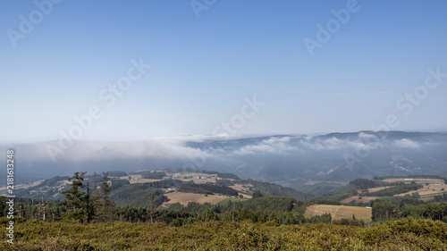 Konstfotografi Panoramic landscape of hills and low sea of clouds with copy space