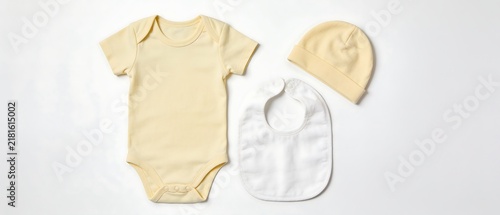 Beige baby onesie bodysuit with bib hat set.