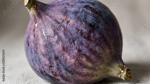 Macro Close-Up of Fresh Ripe Purple Fig Showing Detailed Skin Texture and Natural Bloom