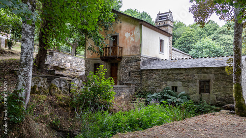 Obraz na plátne Traditional stone watermill with grinding millstones in rural setting