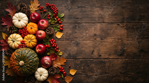 Autumn harvest composition with pumpkins apples and berries on a dark rustic wooden background fall pumpkins red berries wooden table dark wood