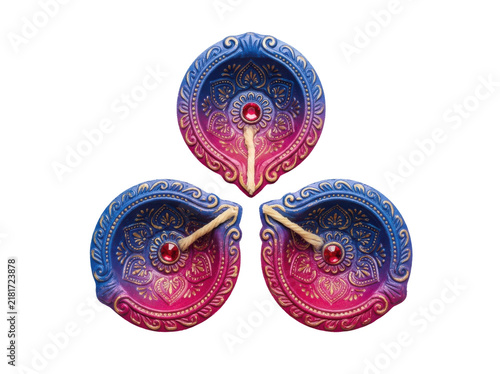 Three decorative traditional indian clay oil lamps or diyas with wicks, top view, isolated on transparent background