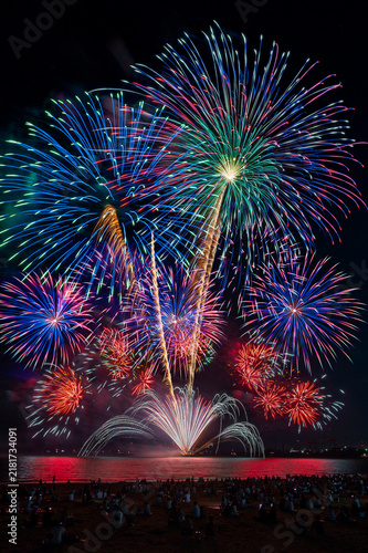 The crowd of Silhouette watching firework isolated display for Japan summer celebration on beach