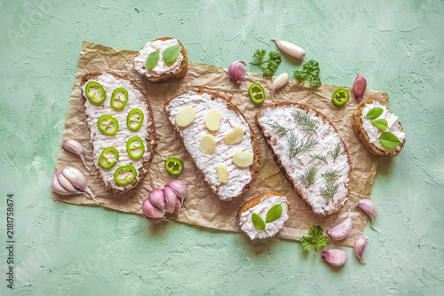 Traditional lard spread smalec sandwiches on rustic bread with garlic and jalapenos