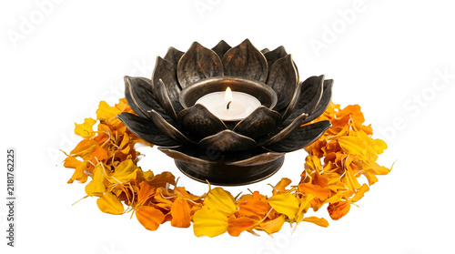 Bronze metal lotus flower candle holder surrounded by scattered orange marigold petals on white
