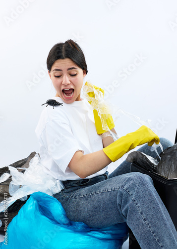 A woman found a huge bug in the trash. A comical cleaning situation