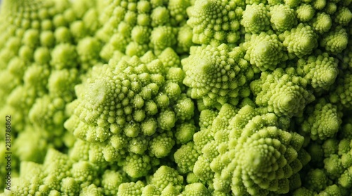 Vibrant romanesco broccoli showcases intricate geometric fractal patterns in this extreme macro close up view highlighting natural bright green textures