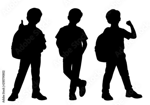 Obraz na plátně Black silhouette of three school boys standing in different poses with backpacks, isolated on a white background