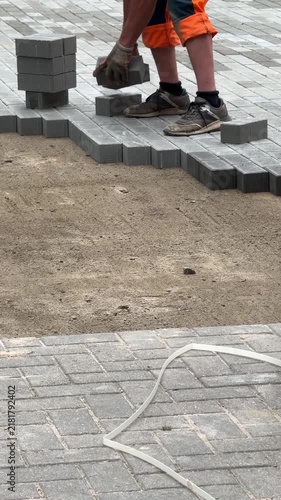Worker Laying Paving Blocks On Sand Foundation Video