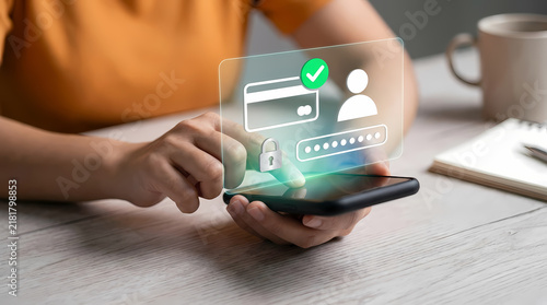 Woman using smartphone with glowing digital overlay showing credit card and login icons for secure online financial transactions and account access.