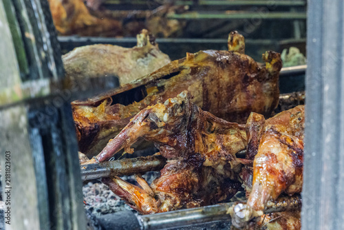 Whole Roasted Lamb On Spit Over Hot Coals At Traditional Outdoor Barbecue Roast