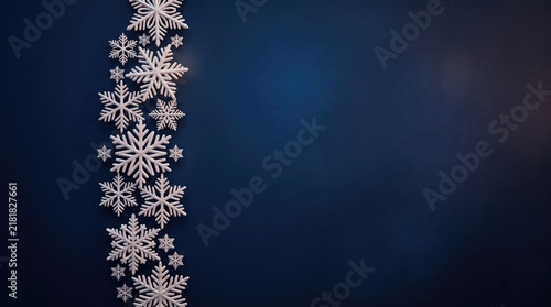3d Christmas Day abstract background new 2026 Beautiful collection of white snowflakes on dark blue gradient background illustration