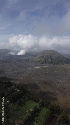 Drone view of the smoking bromo crater and the batok volcano in the tengger caldera, east java