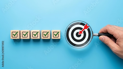 Quality management processes and business strategy planning shown through a target and check mark blocks.