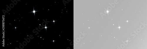 Luminous white stars shine between small sparkles and delicate light dots