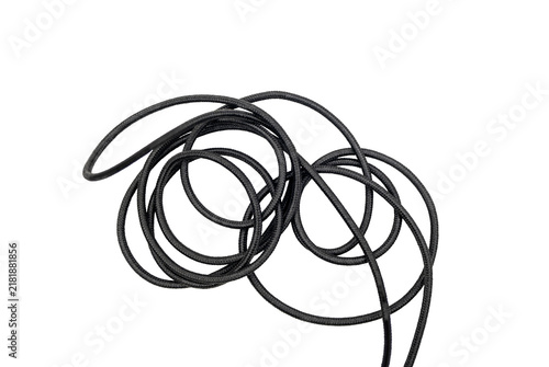 Konstfotografi Tangled black cord coiled against a transparent background, showing loops, texture, and overlapping strands in a simple isolated composition