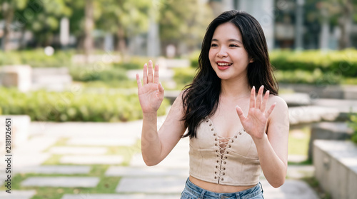 Quadro su tela Woman Showing Stop Gesture in Sunny Garden
