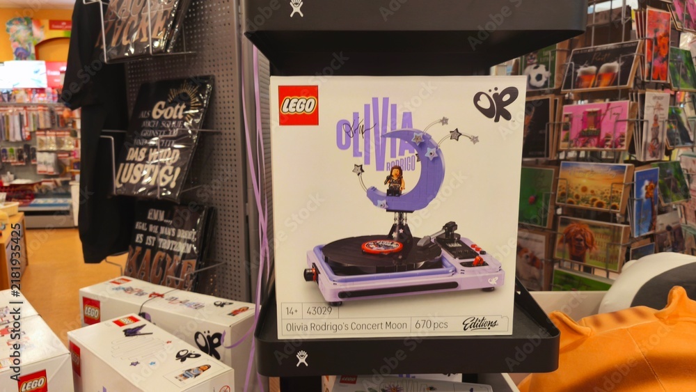 Obraz premium Potsdam, Germany - September 03, 2026: LEGO Olivia Rodrigo's Concert Moon set displayed on a shelf with various merchandise in a retail store environment