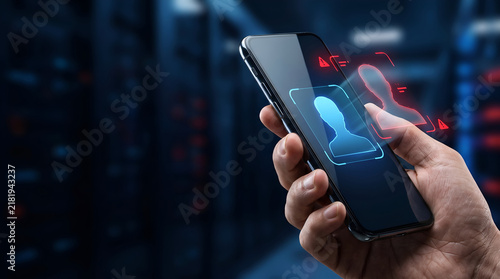 Secure mobile device displaying holographic biometric facial recognition interface with red alert for unauthorized login attempt within a dark professional data center server room environment.