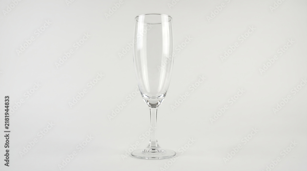 Obraz premium Elegant clear glass champagne flute with a slender stem and round base isolated on a white background isolated on white background